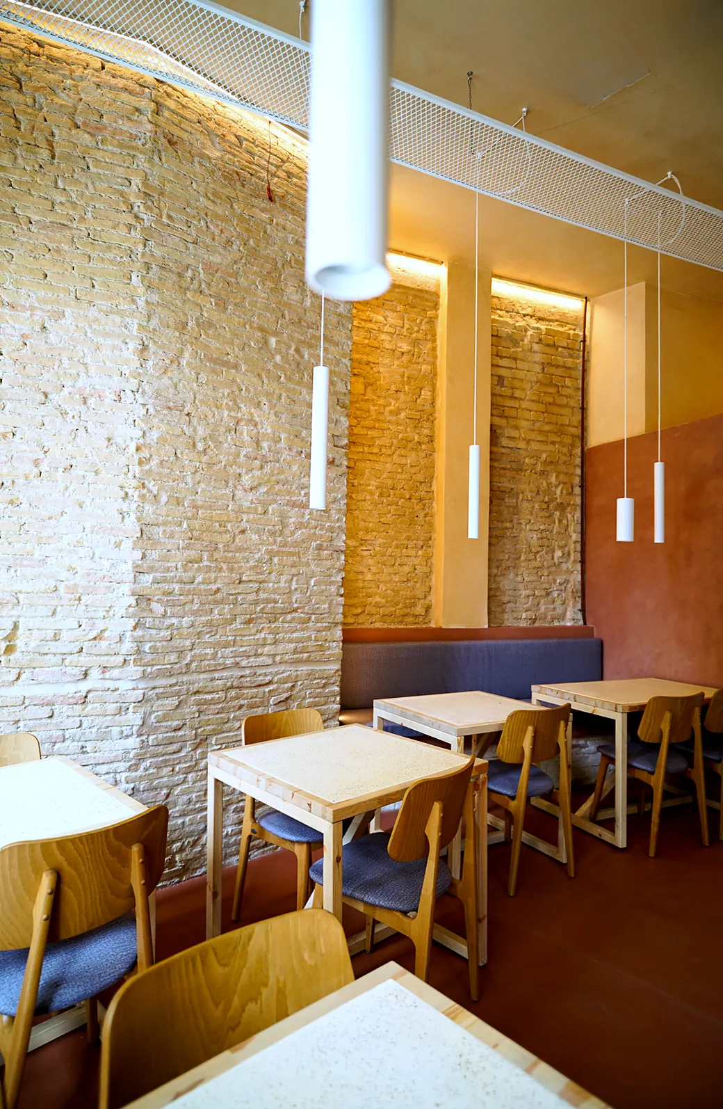Tables along the brick wall