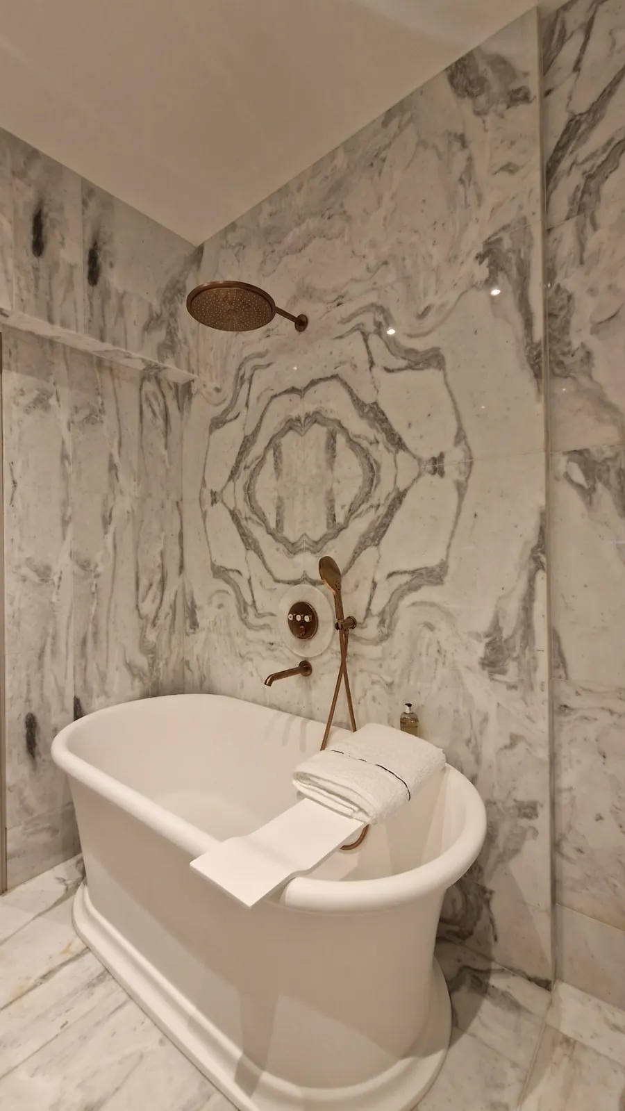 Kolonaki: Marble-clad bathroom with a freestanding bathtub