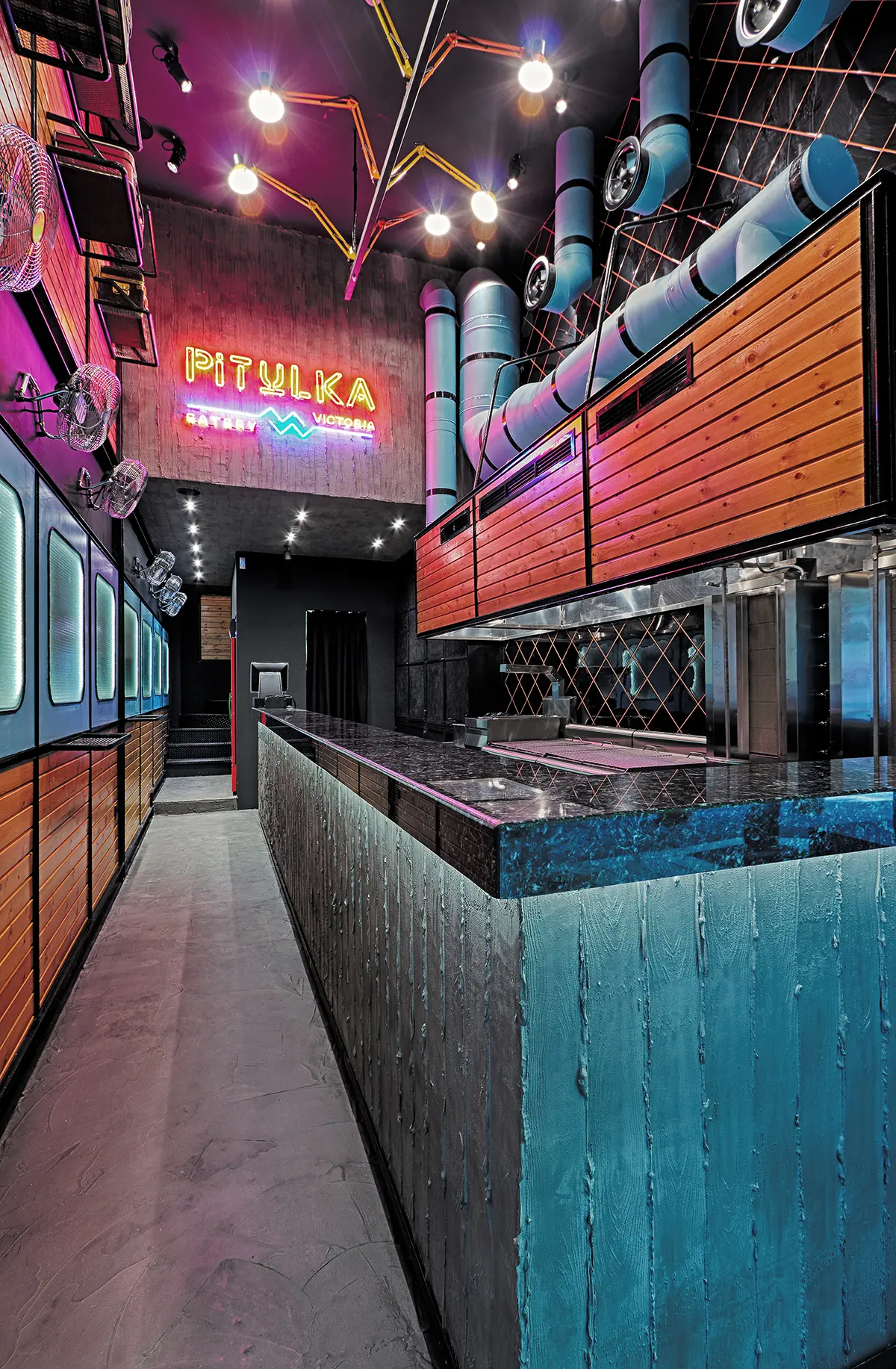Pitulka: The room with the long bar and neon lights