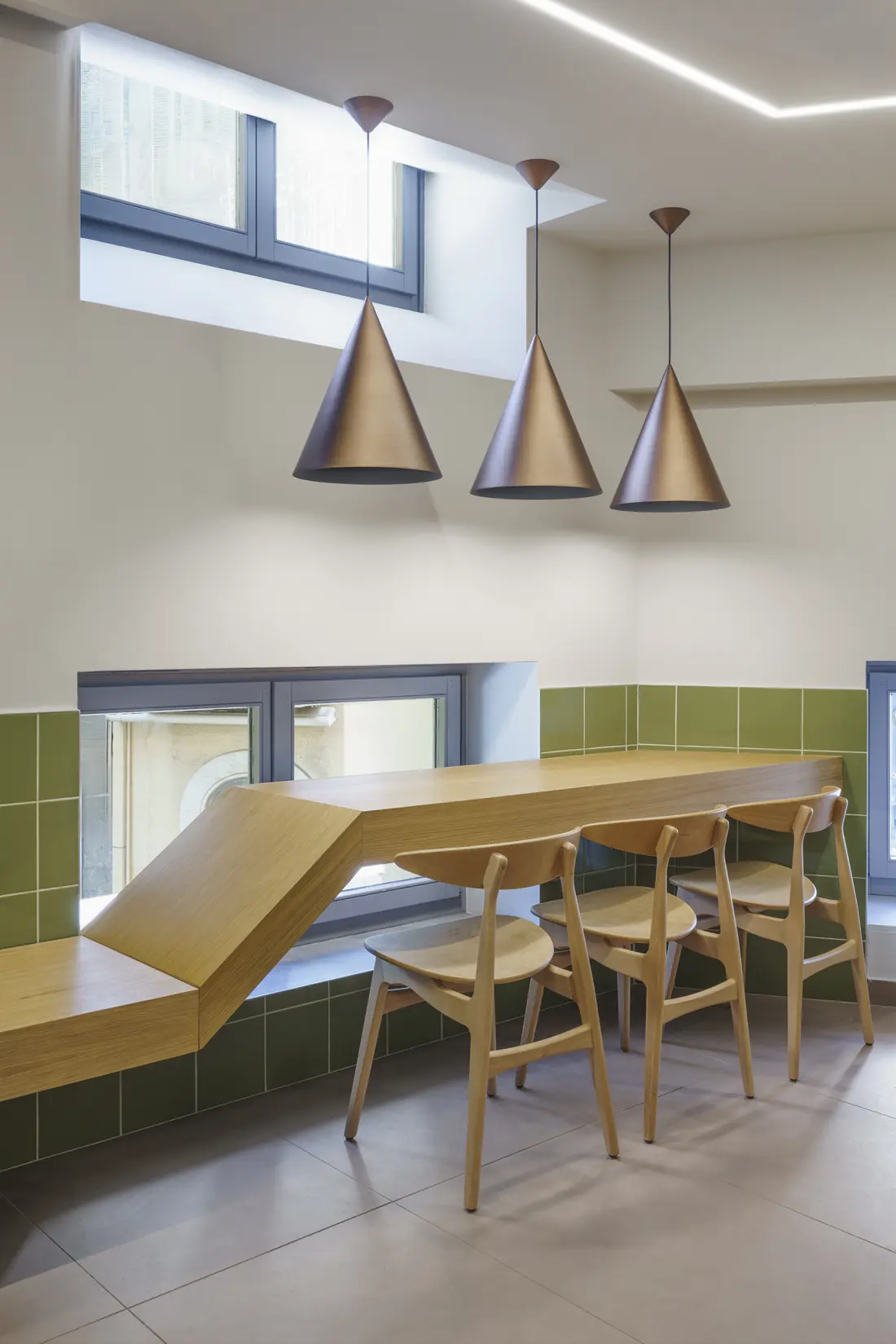 Wooden counter beneath conical pendant lights